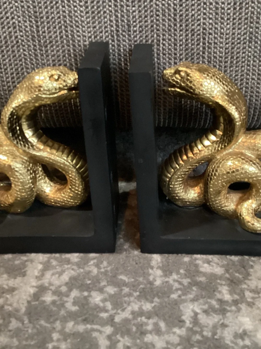 Cobra Snake Bookends, coiled snake motif in metallic gold on matte black stands
